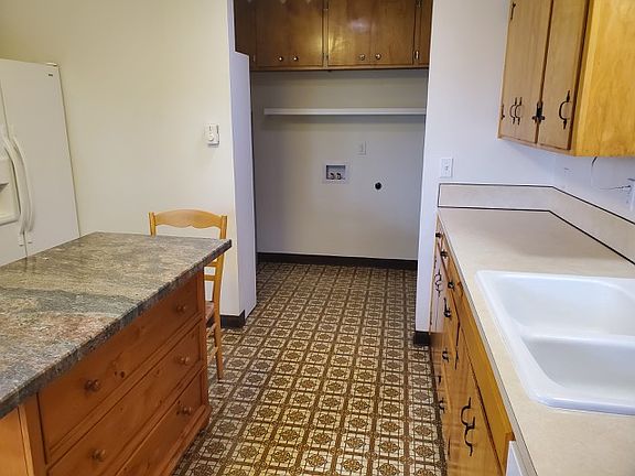 kitchen looking into laundry area