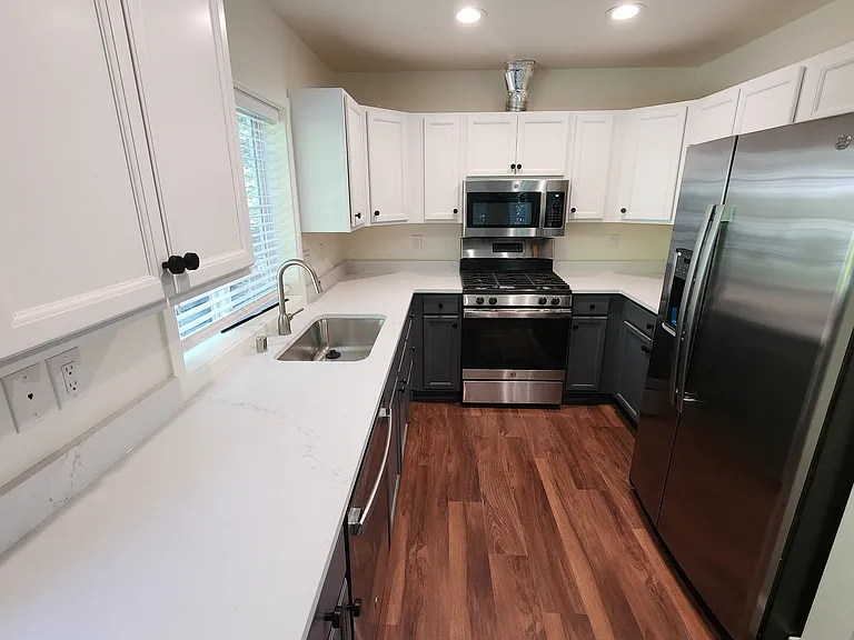 Lot#31 - Stone countertops , new cabinets, New SS Appliances.