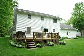 Large deck, recently stained and cleaned, great for entertaining and cookouts with lots of shade in 