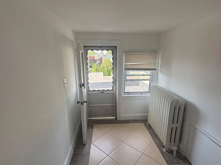 Kitchen Exit to outside roof & fire escape