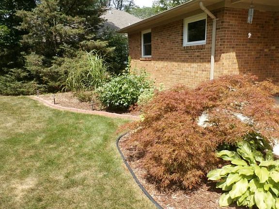 The landscaping is finished in the front yard, with easy care plantings.