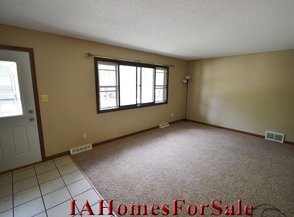 Living Room - main level living room, ceramic tile entry, new carpet and paint, coat closet just inside the entry. 