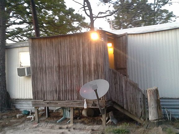 Back view ( porch looks like a tiki hut)