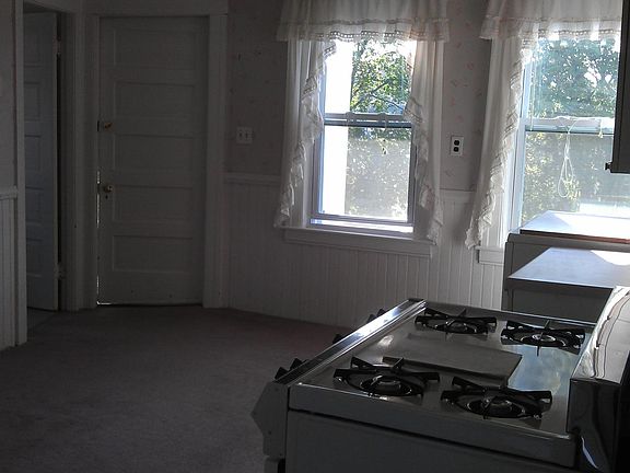 Carpeting to be taken out and replaced with Linoleum. No Curtains!