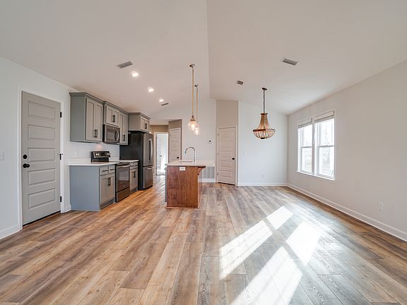 open floor plan, main living space/kitchen/dining