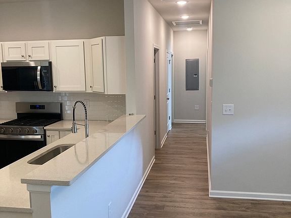 Great room and the main hallway, Kitchen is on the left and it is an open plan