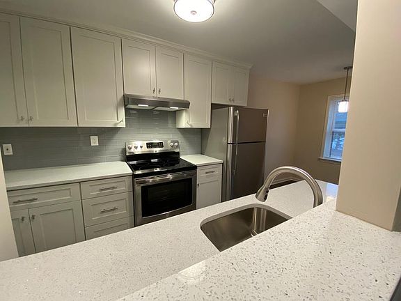 The kitchen flows beautifully into the large living room.
