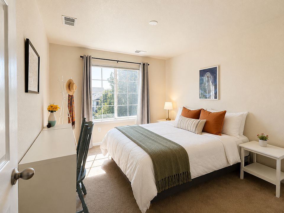 Same room shown furnished_available with queen bed, nightstands and workspace for $925/month. Digitally staged; bedding, pillows, linens and decor are not included.