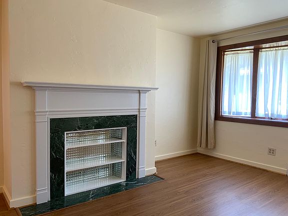 Decorative fireplace and mantle in the living room.