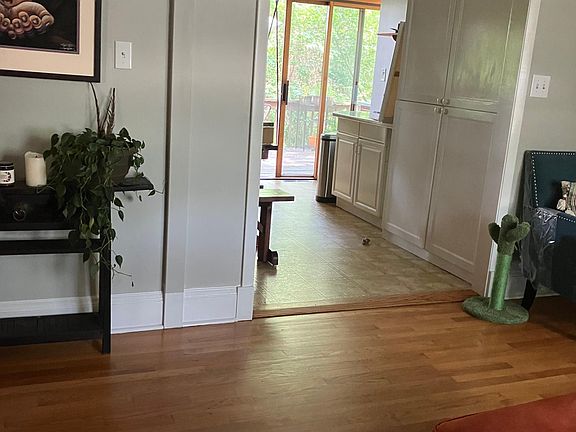 Living room to kitchen to back deck