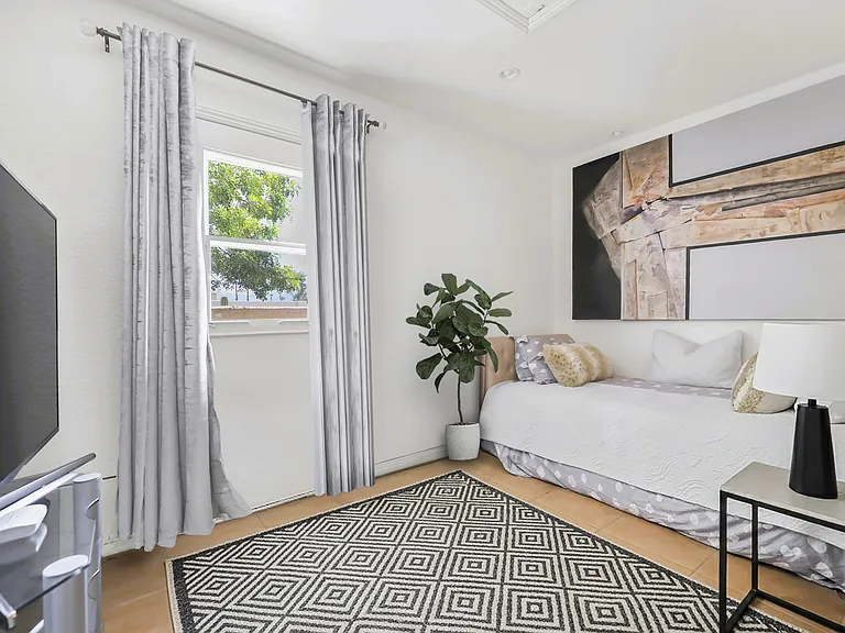 Room with private entrance off of side patio.