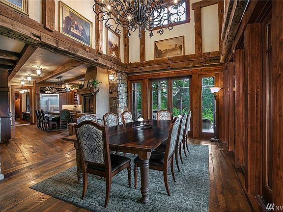 One Hundred and Fifty Year Old Reclaimed Oak Hand-Hewn, Mortise And Tenon Beams And A Six Foot Iron Chandelier Welcome You To Your Dining Experience. 