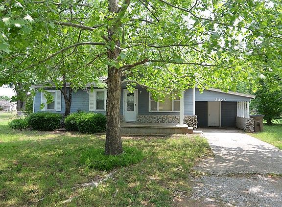 Cute curb appeal with beautiful trees!