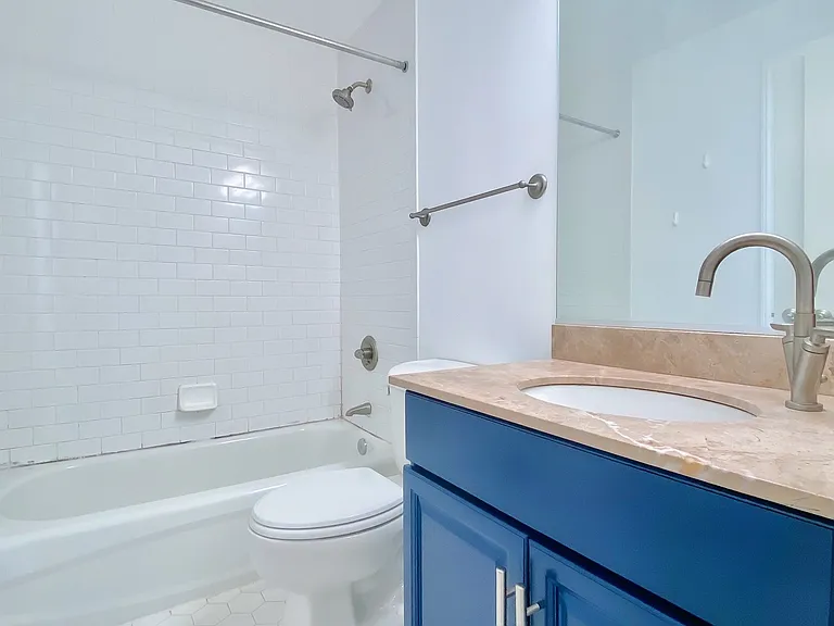 Shared bathroom with tub for second and third bedrooms