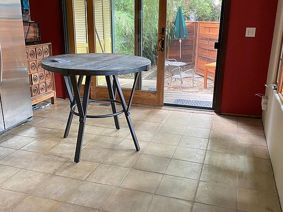 Lovely bright breakfast area windows south and doors east for morning light