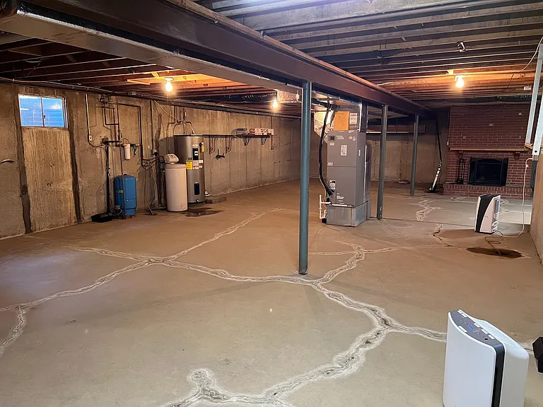 Basement looking from base of stairs
Fireplace straight ahead is non functional and not to be used.
Sq FT: 1375
50'8" x 23'10" plus 22'10" x 7'6"