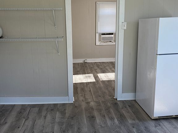 Luxury Vinyl Plank Throughout and includes Refrigerator and Stove
