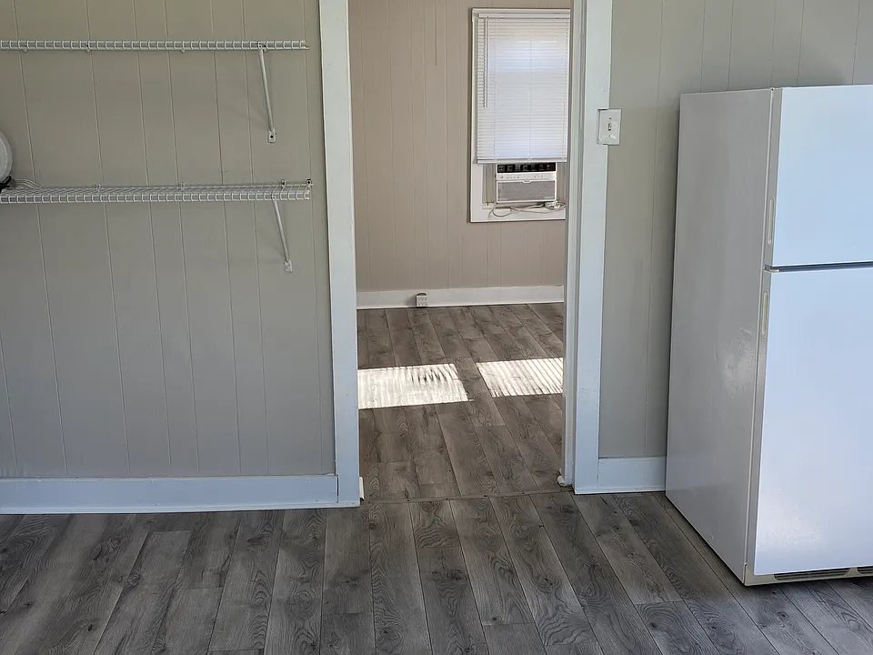 Luxury Vinyl Plank Throughout and includes Refrigerator and Stove