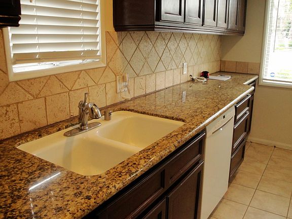 Kitchen with Dishwasher and Granite Counters