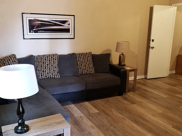 This is the living room. We have a new black leather couch & recliner now. But as it may not be furnished its to show the room from the front entrance.