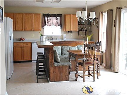 Eat-in kitchen has privacy of formal diningg