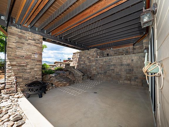 Private covered patio with mountain and lake views