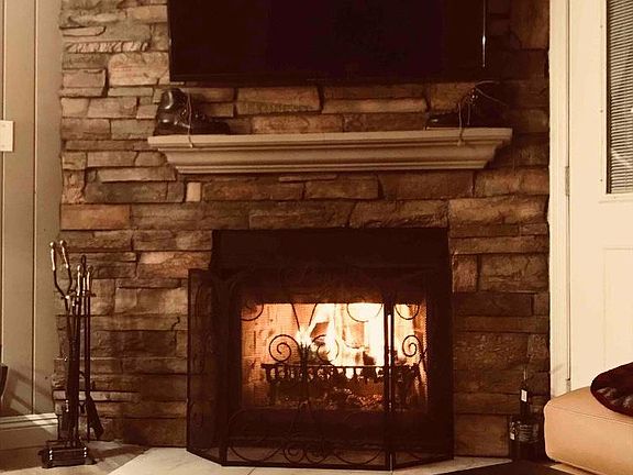 Flatscreen TV over fireplace