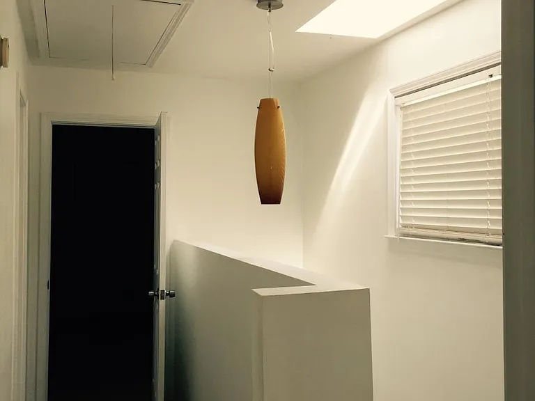 The upstairs hallway run between the two bedrooms.