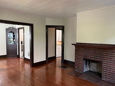 Living room is 14' x 14' (Original fireplace is ornamental, it is not suitable for use).