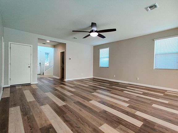 Living room with view of garage entrance
