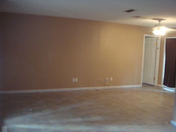 DINING ROOM L SHAPED AND VERY LARGE. ALSO HAS SLIDING GLASS DOOR EXIT TO PATIO