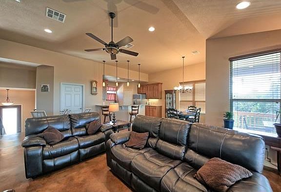 Looking back at living areas from rear of home highlights the natural light throughout this space