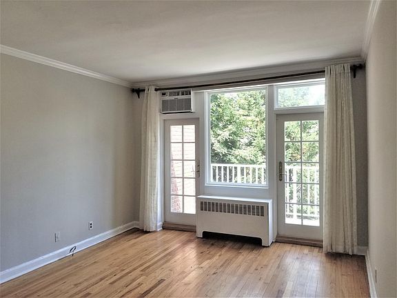 Living Room with French doors leading to Private Balcony.