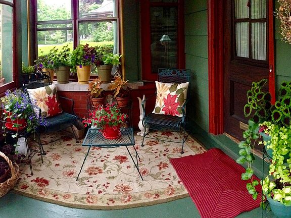 Private sunny front porch. The perfect place for morning coffee or afternoon relaxation.