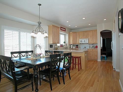Kitchen and dining area with hardwood floors