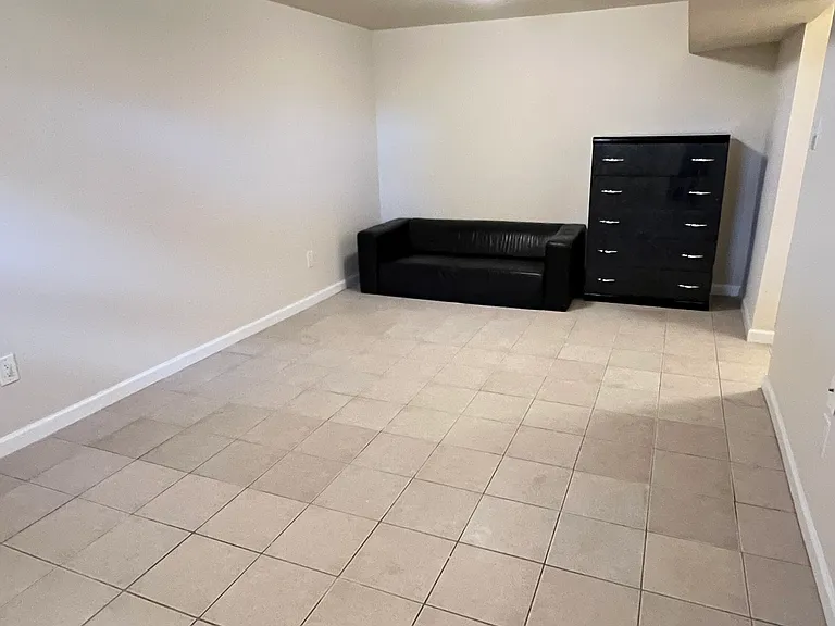 Living room in the basement, furnitures are not included