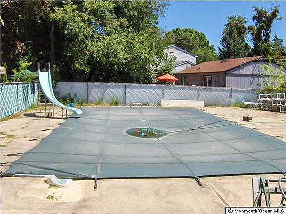 View of the pool looking away from house. Plenty of yard space.