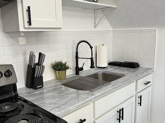 Full kitchen with no-slam cabinets, granite countertops and newer appliances