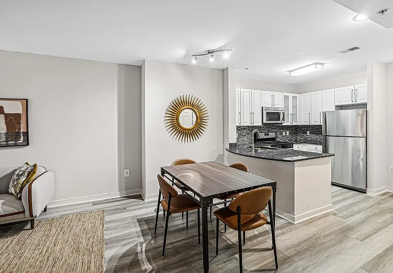 Open Layout Featuring Kitchen with Bar Seating and Dining Table
