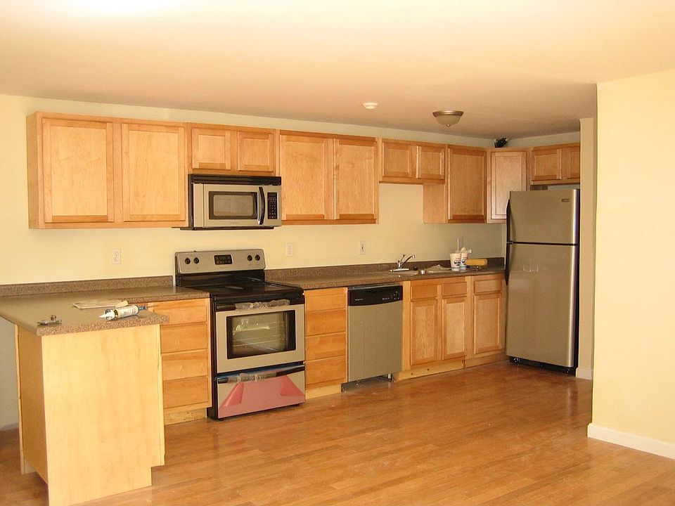 Brand new open kitchen with stainless appliances