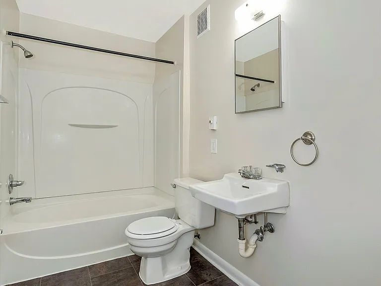 Step into serenity with this beautifully designed bathroom, complete with contemporary fixtures.