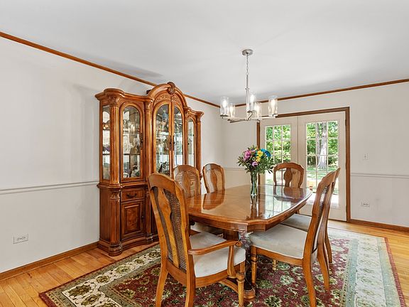Entertain with ease in the Dining Room with French Doors to deck. Hardwood floors.