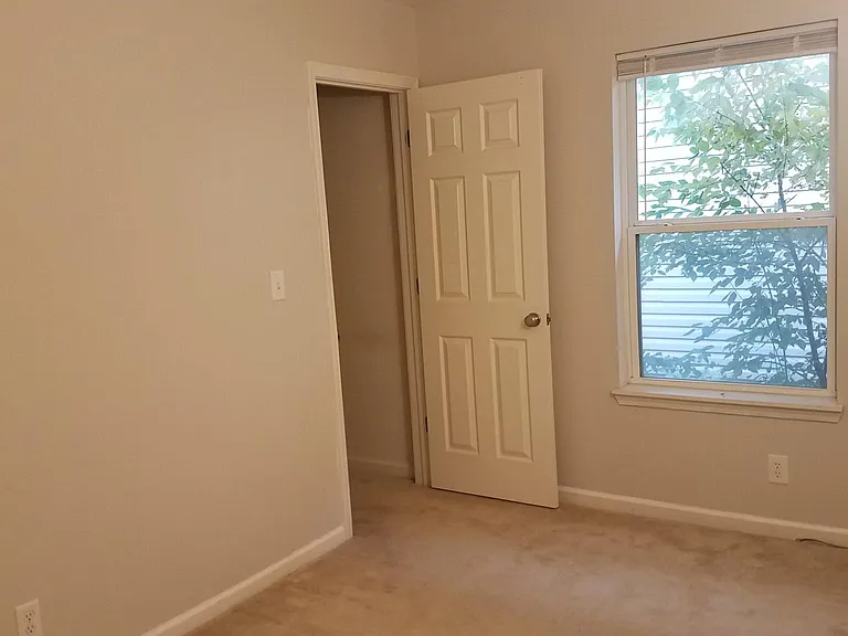 Bedroom with walk-in closet