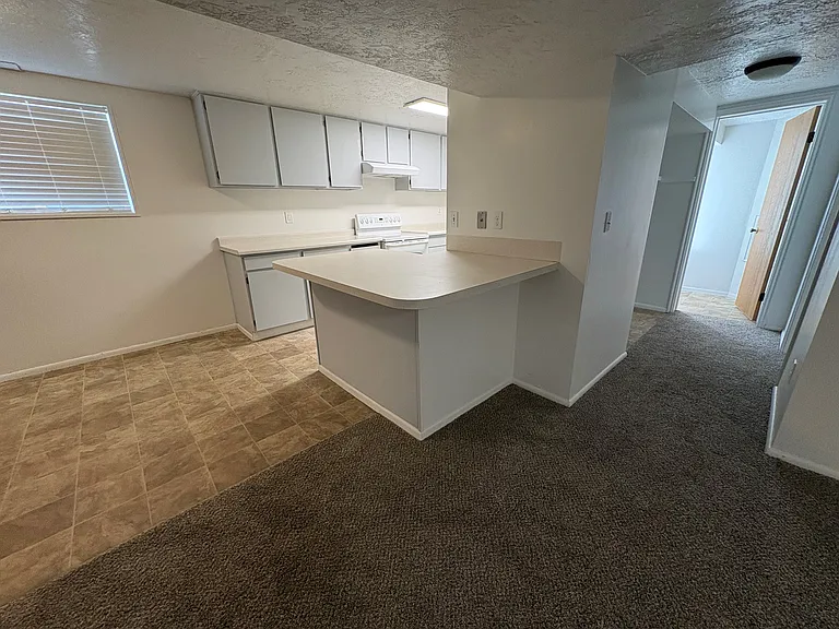 The kitchen island is definitely a peninsula, but it works just the same way!