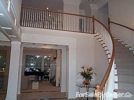 Entry Way with Curved Staircase