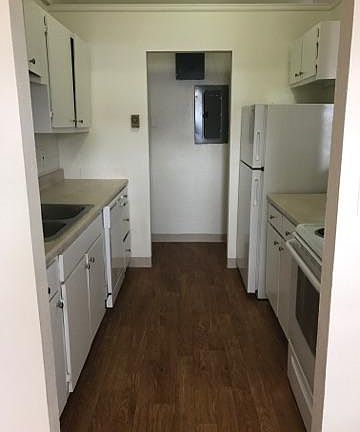 Kitchen with utility closet with washer/dryer hook-ups