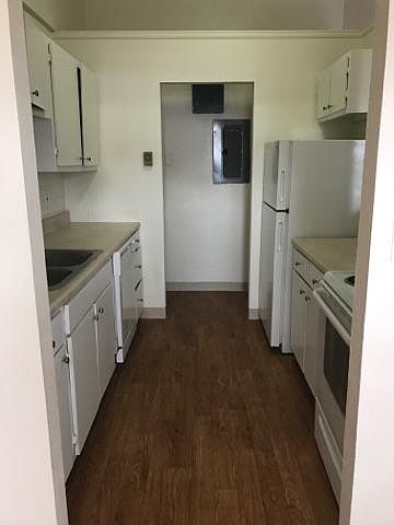 Kitchen with utility closet with washer/dryer hook-ups