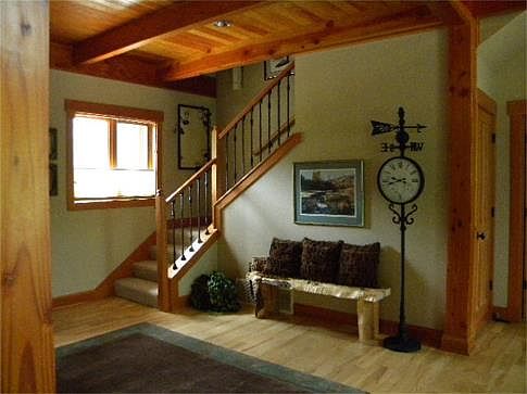 Local craftsman and masonry is quality workmanship. River rock hearth and maple mantle.