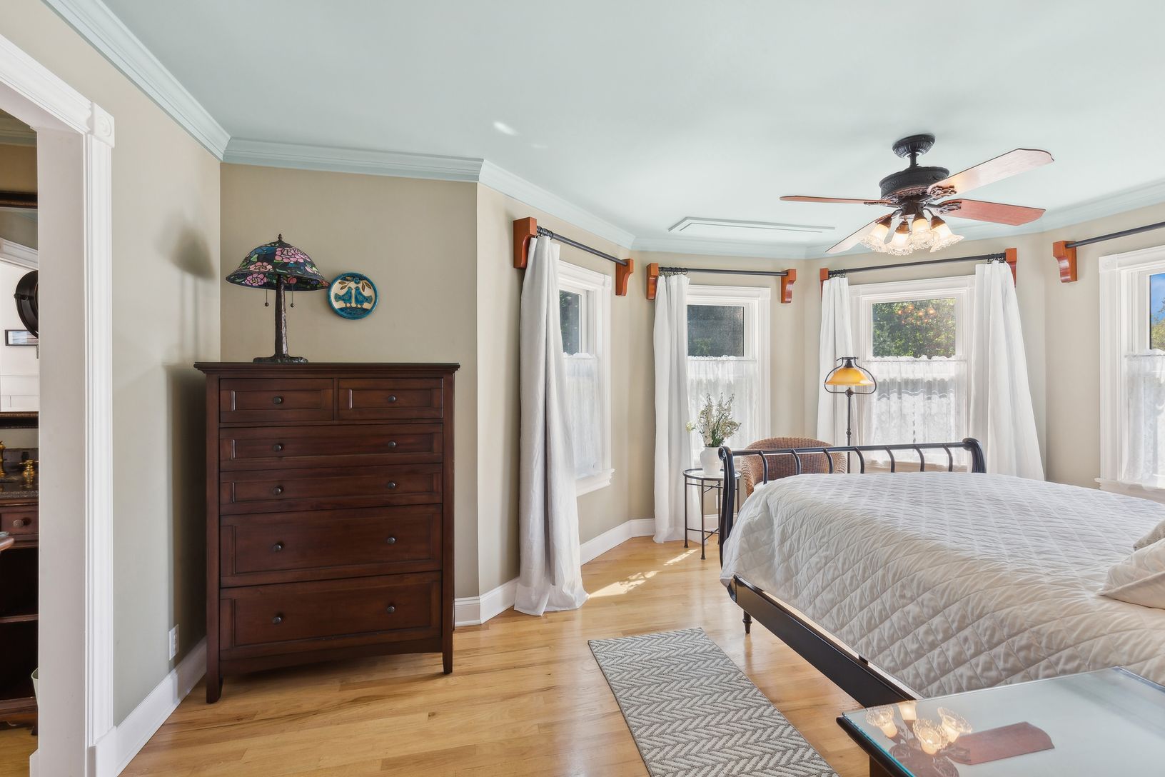  Primary Bedroom En Suite. A Flat Screen Television Lowers from Ceiling in Front of Bed