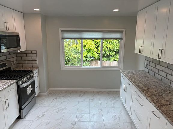 Spacious kitchen with new flooring